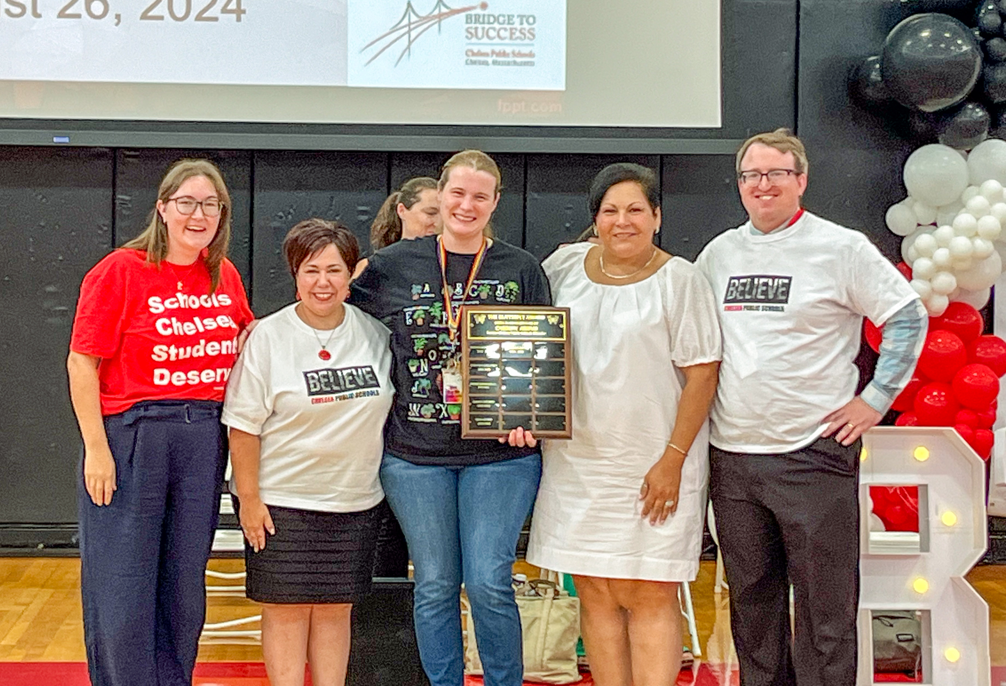 Nina Silva-Bowe received her Butterfly Award at the Chelsea Public Schools staff Convocation on Monday, August 26, 2024 